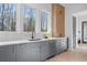 Modern kitchen with gray cabinets, quartz countertops and a large sink at 160 Cedarwood Ln, Roswell, GA 30075