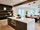 Modern kitchen with dark cabinetry, quartz countertops and island at 160 Cedarwood Ln, Roswell, GA 30075