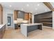 Modern kitchen with gray and wood cabinets, quartz countertops, and large island at 160 Cedarwood Ln, Roswell, GA 30075