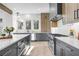 Modern kitchen with stainless steel appliances, custom cabinets, and a sleek island with stone countertop at 160 Cedarwood Ln, Roswell, GA 30075