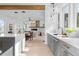 Modern kitchen with gray cabinetry, quartz countertops, and island at 160 Cedarwood Ln, Roswell, GA 30075