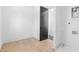 Clean laundry room with light hardwood floors, white walls, and modern trim at 160 Cedarwood Ln, Roswell, GA 30075