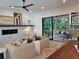 Living room with fireplace and seamless transition to a covered outdoor patio for relaxed living at 160 Cedarwood Ln, Roswell, GA 30075