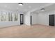 Bright, airy living space with hardwood floors, multiple windows, and modern recessed lighting at 160 Cedarwood Ln, Roswell, GA 30075