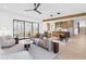 Open living space with modern furnishings, exposed beam, and access to a covered patio at 160 Cedarwood Ln, Roswell, GA 30075