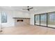 Bright living room with hardwood floors, fireplace, and large windows at 160 Cedarwood Ln, Roswell, GA 30075