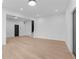 Spacious living area featuring sleek hardwood floors, recessed lighting, and an open layout at 160 Cedarwood Ln, Roswell, GA 30075
