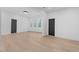 Spacious living room with light wood floors and natural lighting at 160 Cedarwood Ln, Roswell, GA 30075