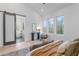 Bright and airy main bedroom with light wood floors, sitting area, and spa-like ensuite bath at 160 Cedarwood Ln, Roswell, GA 30075