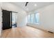 Main bedroom with hardwood floors, sliding barn door to ensuite at 160 Cedarwood Ln, Roswell, GA 30075