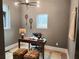 Home office with wood desk, comfortable seating, and natural light at 160 Cedarwood Ln, Roswell, GA 30075