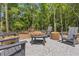 Tranquil outdoor area featuring comfortable seating around a cozy fire pit, perfect for gatherings at 160 Cedarwood Ln, Roswell, GA 30075