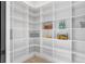 Walk-in pantry with ample shelving for organized storage and convenience at 160 Cedarwood Ln, Roswell, GA 30075