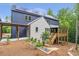 Modern home featuring solar panels, with a large wooden porch and landscaped yard at 160 Cedarwood Ln, Roswell, GA 30075