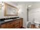 Basement bathroom with double vanity, large mirror, and a walk-in shower at 2148 Allgood Rd, Marietta, GA 30062