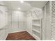 Well-organized basement closet with wire shelving and additional storage at 2148 Allgood Rd, Marietta, GA 30062