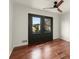 Bedroom with hardwood floors and French doors leading to balcony at 2148 Allgood Rd, Marietta, GA 30062