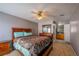 Spacious bedroom with wood furniture and ceiling fan at 3301 Henderson Mill Rd, Atlanta, GA 30341