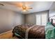 Bright bedroom with ceiling fan and large window at 3301 Henderson Mill Rd, Atlanta, GA 30341