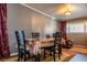 Dining area with four chairs and a table, hardwood floors at 3301 Henderson Mill Rd, Atlanta, GA 30341