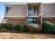 Townhouse exterior with brick and neutral siding at 3301 Henderson Mill Rd, Atlanta, GA 30341