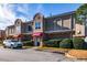 Townhouse building showcasing landscaping and a car in the parking lot at 3301 Henderson Mill Rd, Atlanta, GA 30341