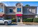 Townhouse with red awning, landscaping, and car parked in front at 3301 Henderson Mill Rd, Atlanta, GA 30341