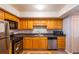 Clean and functional kitchen with wood cabinets at 3301 Henderson Mill Rd # X4, Atlanta, GA 30341