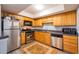 Kitchen boasts stainless steel appliances and wood cabinets at 3301 Henderson Mill Rd # X4, Atlanta, GA 30341