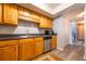 Nice kitchen with wood cabinets, stainless steel appliances, and light gray countertops at 3301 Henderson Mill Rd # X4, Atlanta, GA 30341