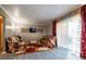 Living room with two floral sofas, a coffee table, and sliding glass doors at 3301 Henderson Mill Rd, Atlanta, GA 30341