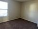 Bright bedroom with large window and carpet at 606 Grenier Ter, Lawrenceville, GA 30045