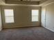 Spacious bedroom with neutral walls and carpet flooring at 606 Grenier Ter, Lawrenceville, GA 30045