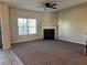 Spacious living room featuring a fireplace and a large window at 606 Grenier Ter, Lawrenceville, GA 30045