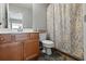 Clean bathroom with shower/tub combo and wood vanity at 705 Pecan Knoll Dr, Marietta, GA 30008