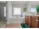 Relaxing bathroom with soaking tub, double vanity, and tile flooring at 705 Pecan Knoll Dr, Marietta, GA 30008