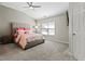 Spacious bedroom with carpeted floor and large window at 705 Pecan Knoll Dr, Marietta, GA 30008