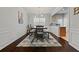 Dining room with dark hardwood floors and modern chandelier at 705 Pecan Knoll Dr, Marietta, GA 30008