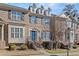 Brick townhouse exterior with blue door, steps, and landscaping at 705 Pecan Knoll Dr, Marietta, GA 30008