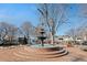 Marietta Town Square fountain with benches and trees at 705 Pecan Knoll Dr, Marietta, GA 30008