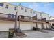 Rear view of townhouses showcasing decks and garages at 705 Pecan Knoll Dr, Marietta, GA 30008