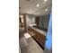 Modern bathroom with double sinks, granite countertop, and large mirror at 199 14Th Ne St # 1512, Atlanta, GA 30309