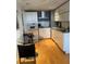 Modern kitchen with white cabinetry and breakfast bar at 199 14Th Ne St # 1512, Atlanta, GA 30309