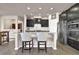 Modern kitchen with dark cabinetry, granite countertops, and stainless steel appliances at 6825 Ashford Manor Way, Cumming, GA 30040