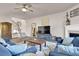 Comfortable living room with hardwood floors, a fireplace, and plenty of natural light at 6825 Ashford Manor Way, Cumming, GA 30040