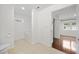 Clean and bright bathroom with a bathtub and access to another bedroom at 520 Mary Sw St, Atlanta, GA 30310