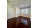 Simple bedroom with hardwood floors and a window at 520 Mary Sw St, Atlanta, GA 30310
