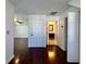 Bright hallway with dark hardwood floors leading to bathroom and bedroom at 520 Mary Sw St, Atlanta, GA 30310