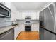 Modern kitchen featuring stainless steel appliances and white cabinets at 520 Mary Sw St, Atlanta, GA 30310