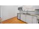 Modern kitchen with white shaker cabinets, granite counters, and stainless steel appliances at 520 Mary Sw St, Atlanta, GA 30310
